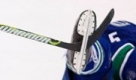 Vancouver Canucks' Christian Ehrhoff, right, of Germany, gets tangled up on Calgary Flames' Theoren Fleury's stick during the second period of an NHL preseason hockey game in Vancouver, British Columbia on Monday, Sept. 21, 2009. (AP Photo/The Canadian Press,Jonathan Hayward) Foto: ap