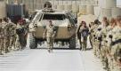 Bundeswehrsoldaten geleiten im Feldlager Kundus in Afghanistan während einer Trauerfeier für einen gefallenen 26-jährigen Sanitäts-Oberfeldwebel aus dem Fallschirmjägerbataillon 313 einen Transportpanzer mit dem Sarg des Bundeswehrsoldaten. Foto: ap