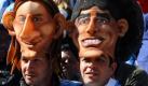 Doppelkopf: Zwei Fans aus Argentinien zeigen, wer ihre großen Idole sind, mit Masken von Lionel Messi und Diego Maradona auf dem Kopf. Foto: dpa