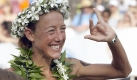 Chrissie Wellington jubelt als alte und neue Siegerin und mit einem neuen Streckenrekord. Foto: dpa