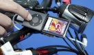 Ein Netzgerät, aus der Energie eines Nabendynamos gespeist, fungiert als multifunktionelles Kraftwerk für GPS-Gerät oder den MP3-Player. Das dürfte vor allem für Reiseradler abseits geteerter Wege interessant sein. Foto: Foto: Messe Friedrichshafen, www.messe-friedrichshafen.de