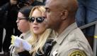 US actress Lindsay Lohan (C) accompanied by LA County Sheriff deputies leaves the Beverly Hills Courthouse for lunch break after a morning probation status hearing which could land her in jail in Beverly Hills, California, USA, 06 July 2010. Lohan has been charged with violating her probation when her alcohol detection device went off at a MTV Movie Awards after party. The hearing relates to her August 2007 no contest pleas to two counts each of drink driving and being under the influence of cocaine, along with a reckless driving charge. EPA/MIKE NELSON +++(c) dpa - Bildfunk+++ Foto: dpa