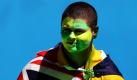 Ein junger Mann mit bemaltem Gesicht feiert bei den Australian Open in Melbourne den Australia Day. Foto: dpa