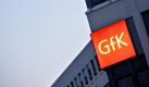 Das Logo der GfK, der Gesellschaft für Konsumforschung, am Hauptsitz des Unternehmens in Nürnberg. Foto: Daniel Karmann Foto: dpa