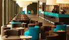 Die Budget Design Hotelkette Motel One bietet mittlerweile in 27 Hotels von Hamburg bis München viel Design für wenig Geld. Echt nobel: Die Hotellounge in Leipzig wurde ganz in den typischen Blau- und Brauntönen gehalten. Foto: Motel One