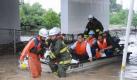 NAGOYA, Japan - Office workers are transported by rescue workers after their office was flooded due to heavy rain brought by approaching Typhoon Roke in Nagoya, central Japan, on Sept. 20, 2011. (Kyodo) Photo via Newscom/kyodowc073598/0920016.jpg/1109201634 Foto: dapd