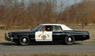 Er tritt das Gaspedal bis zum Bodenblech durch, mit quietschenden Reifen stürmt der 1974er Dodge Monaco voran. Foto: pi