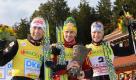Die Österreicher Mario Stecher (v.l.), Felix Gottwald und Bernhard Gruber bei der Siegerehrung des FIS-Weltcups in Schonach. Gottwald gewann vor Stecher und Gruber. Foto: dapd