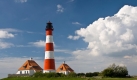 Der Leuchtturm Westerhever ist das Ausshängeschild des Nationalparks Wattenmeer. Der Park ist seit Ende Juni auch Weltnaturerbe. Foto: SRT-Archivbild