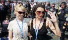 Australian singer Kylie Minogue (L) and her sister Dannii Minogue (R) greets at the grid before the start of the F1 Grand Prix of Australia at the Albert Park race track in Melbourne, Australia, Sunday 18 March 2007. Photo: GERO BRELOER +++(c) dpa - Bildfunk+++ 
 Foto: dpa