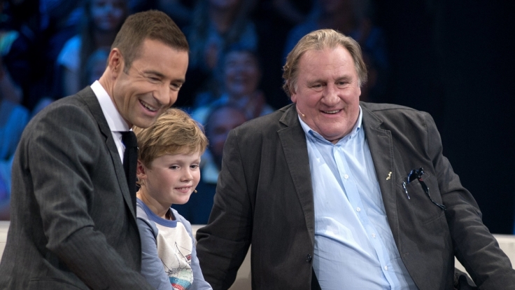 Kai Pflaume mit Julius und Gérard Depardieu.