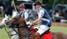 Britain's Prince Harry (foreground) with his father the Prince of Wales (in distance) playing polo for the Beaufort Hunt against Heath Lambert for the Ronnie Wallace Memorial Trophy at Beaufort Polo Club Saturday 24th July 2004. Beaufort Hunt beat Heath Lambert. Foto: dpa