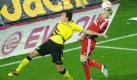 Mladen Petric (rechts) hat bei diesem Kopfballduell gegen Mats Hummels zwar das bessere Timing, blieb ansonsten aber blass. In 90 Minuten kam der HSV nur zweimal gefährlich vor das Tor des Tabellenführers. Foto: dpa