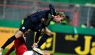 Herthas Fabian Lustenberger (r) erobert sich den Ball vom Essener Thomas Denker. Foto: Roland Weihrauch Foto: dpa