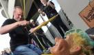 Aktion zum Geburtstag der Augsburger Puppenkiste: Hans Kautzmann hängt die Kasper-Marionette an das Spielkreuz, das mit Hilfe der Feuerwehr nach oben gezogen wird.  Foto: dpa