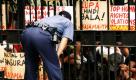 Ein philippinischer Polizist redet mit Demonstranten in Manila, die gegen das Kriegsrecht demonstrieren. Das Recht soll im Süden des Landes angewendet werden, da dort der Ausnahmezustand deklariert wurde. Die Demonstranten befürchten, dass es eine Ausweitung des Kriegsrechts auf das gesamte Land geben könnte.  Foto: ap