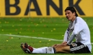 Germany's forward Mario Gomez sits on the pitch in front of an advertisement of a German bank during the World Cup group 4 qualifying soccer match between Germany and Liechtenstein in Leipzig, Germany, on Saturday, March 28, 2009. Germany won by 4-0. (AP Photo/Fabian Bimmer) Foto: ap