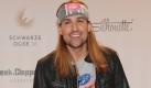 Stargeiger David Garrett sieht aus, als ob er einer Hair-Metal-Band der 1980er Jahren entsprungen ist - da macht einer auf wilder Rocker. Foto: dpa