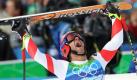 Didier Defago schreit die Freude über seinen Lauf hinaus. Er und nicht sein favorisierter Landsmann Didier Cuche gewinnt die Königsdisziplin der Ski Alpinen: die Abfahrt. Foto: dpa