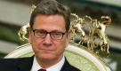 Aussenminister Guido Westerwelle (FDP) sitzt am Donnerstag (17.11.2011) in Aschgabat in Turkmenistan bei einem Gespraech mit dem turkmenischen Staatspraesidenten Gurbanguli Berdymuchamedow. Westerwelle haelt sich zu einem zweitaegigen Besuch in dem zentralasiatischen Land auf. Foto: Michael Kappeler/Pool/dapd Foto: dapd