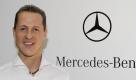 Michael Schumacher posiert in Brackley vor dem Logo von Mercedes-Benz. Foto: dpa