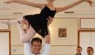 A file picture dated 21 October 2004 of US actor Patrick Swayze lifting a girl during his visit to a ballet school in Warsaw, Poland. According to media reports, Swayze?s publicist Annett Wolf says the 57-year-old 'Dirty Dancing' actor died 14 September 2009 with family at his side. He came forward about his illness last spring, but continued working as he underwent treatments. Foto: ap