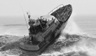 ** RETRANSMISSION TO CORRECT SPELLING OF CITY FROM MANTAUK TO MONTAUK ** A United States Coast Guard rescue boat battles the surf off Montauk Point in New York, Saturday, Aug. 23, 2009. A Coast Guard commander tells Newsday that Chief Petty Officer James Weber put his boats and crews in a dangerous situation during the August storm. Weber has been relieved of command after photos turned up on the Internet of two rescue boats training in heavy surf generated by Hurricane Bill. (AP Photo/Thomas Colla) Foto: ap