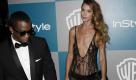 Mit einem Hauch von Nichts: Sean «P. Diddy» Combs schaut nach, ob an seiner Begleiterin Erin Wasson auch wirklich alles dran ist. Foto: dapd