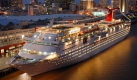 Hier liegt die Carnival Fantasy im Hafen von New Orleans. Das Schiff gehört zur Carnival Corporation, die im vergangenen Quartal einen Umsatzeinbruch von rund einem Drittel zu verzeichnen hat. Foto: ap