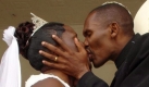 Rebel Catholic Priest Godfrey Shiundu, from the Reformed Catholic Church (RCC) kisses his newly wedded wife and longtime girlfriend Stellah Nangila during a colorful ceremony at the Kitale Agricultural showgrounds in Kenya, Sunday, 14 May, 2006. The RCC is a US-based Catholic breakaway group that allows its clergy to marry and openly accepts polygamy, making it an accommodating alternative for some African cultures. EPA/STR +++(c) dpa - Bildfunk+++
pixel Foto: dpa