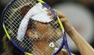 Ana Ivanovic of Serbia reacts to a line call on a break point in her match against Jelena Dokic of Australia at the Brisbane International tennis tournament in Brisbane, Australia, Monday, Jan. 4, 2010. Ivanovic won the match 7-5, 1-6, 6-4.(AP Photo/Rob Griffith) Foto: ap