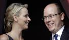 FILE - In this Thursday, June 23, 2011 file photo, Prince Albert II of Monaco and his fiancee Charlene Wittstock attend the St Jean Religious Parade, in Monaco.  Charlene Wittstock has not one, but two tough acts to follow. As the future princess of Monaco and wife to longtime bachelor Prince Albert II, the Zimbabwe-born, South Africa-raised former Olympic swimmer is to succeed Grace Kelly, whose 1956 wedding to Prince Rainier III is still widely seen as the gold standard for royal nuptials. And as if the blue-eyed Hollywood beauty-turned-beloved princess didn't cast a long enough shadow, Albert's long-awaited marriage to Wittstock comes on the heels of the royal wedding of the decade, Kate Middleton's union with Britain's Prince William. It's still the biggest thing to hit Monaco since Grace walked down the aisle in an elegant antique lace gown, ushering in a new era of high-wattage glamour into this tiny Riviera principality known for its high-flying casinos and lax tax laws. (AP Photo/Lionel Cironneau, File) Foto: dapd