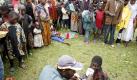A displaced Congolese woman who fainted from hunger while trying to sign up for emergency food rations is given soup by a good-samaritan in Kibati camp in the provincial capital of Goma, Democratic Republic of the Congo, 05 November 2008. As the aid effort is ramped up there is concern that the fragile cease-fire may be under threat by renewed fighting between rebels and militia's loyal to the government in flash point areas throughout the east. EPA/STEPHEN MORRISON +++(c) dpa - Bildfunk+++ Foto: dpa