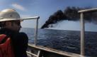A handout photograph made available on 08 May 2010, shows Adam Shaw, a Louisiana oilfield diver assigned to the Premier Explorer, performing a surveillance mission during a controlled fire of the oil-covered waters in the Gulf of Mexico off the coast of Louisiana, USA, 07 May 2010. The U.S. Coast Guard working in partnership with BP PLC, local residents, and other federal agencies is conducting the 'in situ burns' to aid in preventing the spread of oil following the April 20 explosion on Mobile Offshore Drilling Unit Deepwater Horizon. A huge steel dome was placed 08 May over a gushing wellhead on the floor of the Gulf of Mexico in a bid to stop the leak of oil, the US tv news network CNN reported. The four-storey oil-containment dome, weighing some 100 tons, is to try to cap the oil leaking from the sunken Deepwater Horizon rig and then funnel the oil to connecting pipes leading to the surface. EPA/JEFFERY TILGHMAN WILLIAM/US NAVY/HANDOUT EDITORIAL USE ONLY +++(c) dpa - Bildfunk+++  Foto: dpa