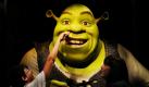 Ein junger Besucher steckt der zuvor vorgestellten 150 Kilo schweren und 2,26 Meter großen Filmfigur Shrek bei Madame Tussauds in Berlin seinen Finger in die Nase -  nur gut, dass der Riese nur aus Wachs ist. Foto: dpa