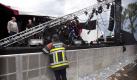 epa02871610 A firefighter stands at a stage after a tent collapsed during at the Pukkelpop music festival in Kiewit, Hasselt, Belgium, 18 August 2011. Three people were killed and 11 were seriously injured in Belgium on 18 August when thunderstorms brought down a stage tent, giant screens and other structures at an outdoor music festival, Flemish broadcaster VRT reported. EPA/HARRY HEUTS +++(c) dpa - Bildfunk+++  Foto: dpa
