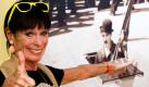 Geraldine Chaplin, die Tochter von Schauspieler und Regisseur Charlie Chaplin (1889-1977), posiert für einen Fotografen vor einem Bild ihres Vaters. Das Berliner Kino Babylon erinnert mit  The Chaplin Complete an den ersten Besuch Charlie Chaplins vor 80 Jahren. Vom 15. Juli bis zum 7. August können sich Besucher alle Filme des Komikers ansehen. Geraldine Chaplin wird als Ehrengast zeitweise anwesend sein. Foto: dapd