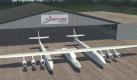 Undatiertes Computerbild zeigt die Vision des bisher größten Flugzeuges auf der Welt, von dem aus Satelliten oder auch Raumfahrzeuge gestartet werden sollen. Foto: Stratolaunch Foto: dpa