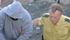 Der angeklagte Amokläufer Georg R. trifft in Handschellen im Landgericht Ansbach ein. Foto: dpa