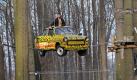 Fliegender Trabi: Ein Trabi im Hochseilgarten des Abenteuerparks Moritzburg bei Dresden soll Abenteurern das Klettern erschweren. Foto: Matthias Hiekel Foto: dpa