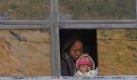 Unterwegs in Nepal: In einem schrottreifen Bus rumpeln Mutter und Kind in Richtung der Hauptstadt Kathmandu. Foto: Narendra Shrestha Foto: dpa