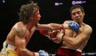 Venezuela's Edwin Valero, left, exchanges punches with Mexico's Antonio DeMarco at a WBC lightweight title fight in Monterrey, Mexico, Saturday, Feb. 6, 2010. Valero won on a TKO after DeMarco sat in his corner and declined to come out for the 10th round. (AP Photo/Eduardo Verdugo) Foto: ap
