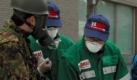Japanese Self Defense Forces doctors check local residents for radiation exposure in Otama village, Fukushima prefecture, Japan, 13 March 2011. Radiation levels at 
a damaged nuclear power plant at Fukushima, 240 kilometres north of Tokyo, were rising well above the legal limits, top government spokesman Yukio Edano said. Reactors at the Fukushima I and II plants lost their cooling functions after power and backup generators were cut off by the quake on 11 March 2011. Foto: dpa
