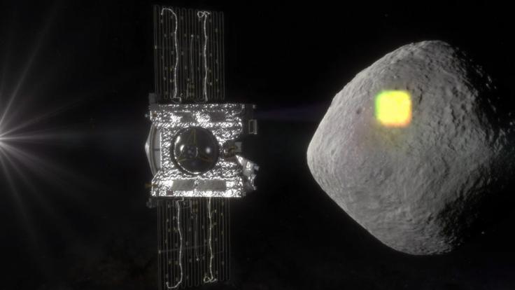 Die undatierte Illustration zeigt die Sonde Osiris Rex (l) und den erdnahen Asteroiden Bennu.