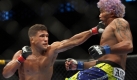 Tyson Griffith trifft Hermes Franca mit einer linken Geraden bei einem Martial Arts Event im amerikanischen Dallas. Franca verlor den Kampf. Einen Punktsieg gibt's für die Frisur. Foto: ap
