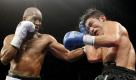Bernard Hopkins, left, of Philadelphia, lands a punch against Enrique Ornelas, of Mexico, during their non-title light heavyweight boxing match, Wednesday, Dec. 2, 2009, in Philadelphia. Hopkins won in 12 rounds with a unanimous decision. (AP Photo/Matt Slocum) Foto: ap