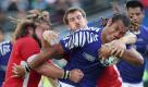 Samoa's Taiasina Tuifua holds onto the ball as he is tackled by Wales' Sam Warburton and Wales' Adam Jones, left, during their Rugby World Cup match at Waikato Stadium in Hamilton, New Zealand, Sunday, Sept. 18, 2011.(Foto:Rob Griffith/AP/dapd) Foto: dapd