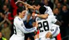 Real Madrid's argentinischer Mittelfeldspieler Angel di Maria feiert zusammen mit seinen Teamkameraden Emmanuel Adebayor und Mesut Özil seinen Treffer zum 3-0 Endstand im Viertelfinalrückspiel der Championsleague gegen Olympique Lyon. Die beiden Deutschen Semi Khedira und Mesut Özil zeigten unter den Augen von Bundestrainer Löw ansprechende Leistungen. Foto: dpa