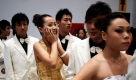 Chinesische Models bereiten sich auf ein Casting für die Top Auto Show in Peking vor. China ist eines der wenigen Märkte für Automobile, die trotz Wirtschaftskrise stetigen Absatz verzeichnen. Foto: ap