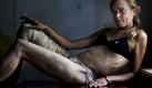 In this photo provided on Friday Feb. 10, 2012 by World Press Photo, the 1st prize Contemporary Issues Singles category of the 2012 World Press Photo contest by Brent Stirton, South Africa, Reportage by Getty Images for Kiev Independent, shows Maria, a drug addict and sex worker, in between clients in a room she rents in Kryvyi Rig, Ukraine. Maria injects drugs on a daily basis and sees many men every week but claims she remains HIV negative. She says she need the money to support herself, her drug habit and her nine-year-old daughter. (Foto:Brent Stirton, Reportage by Getty Images for Kiev Independent/AP/dapd) Foto: dapd